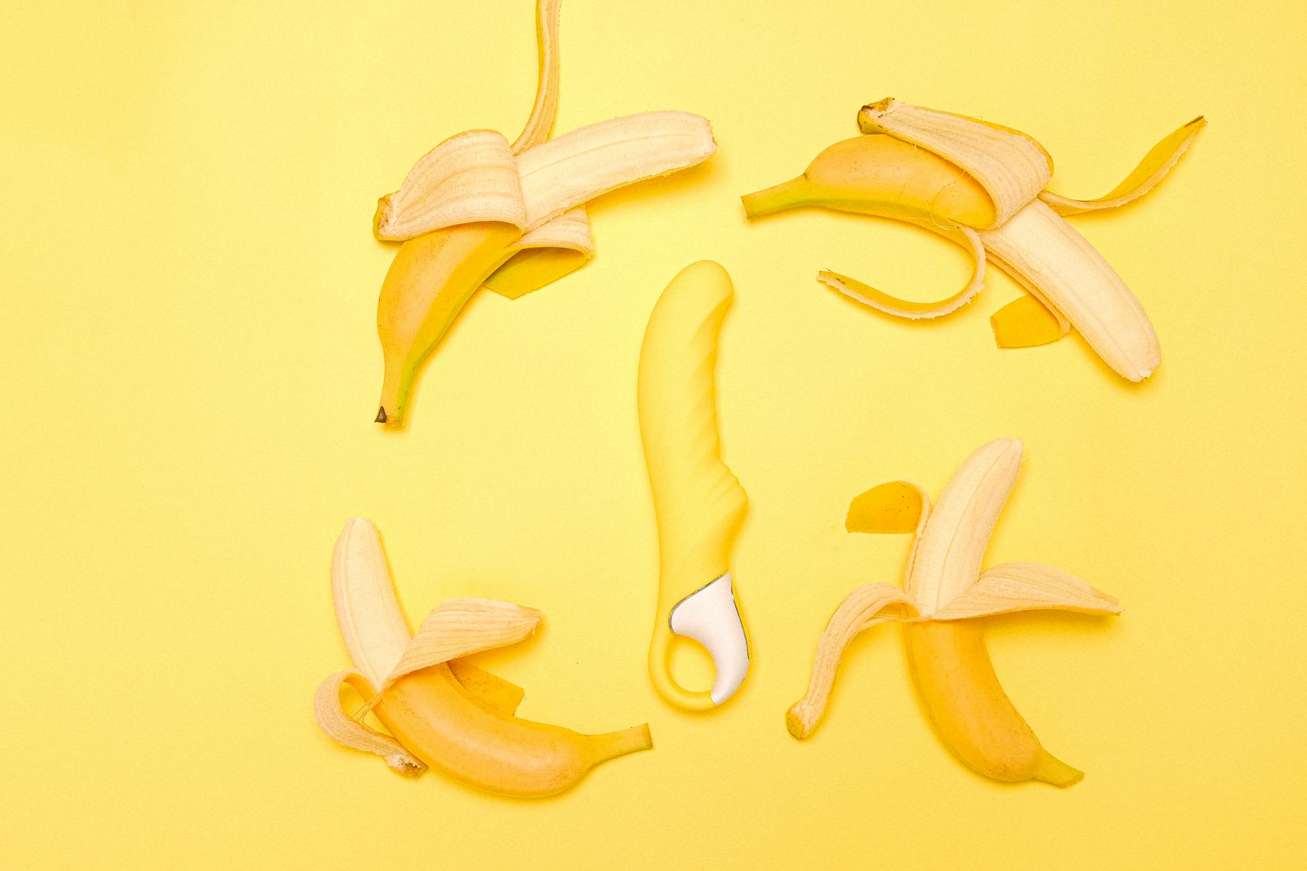 Yellow lemon vibrator on a bright background, symbolizing postpartum pleasure recovery.